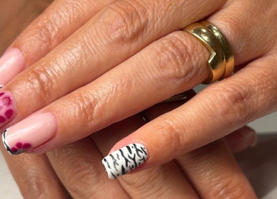 Stylish nail art at By Madison Olivia, Kirk Sandall, England, GB featuring pink and black zebra patterns.