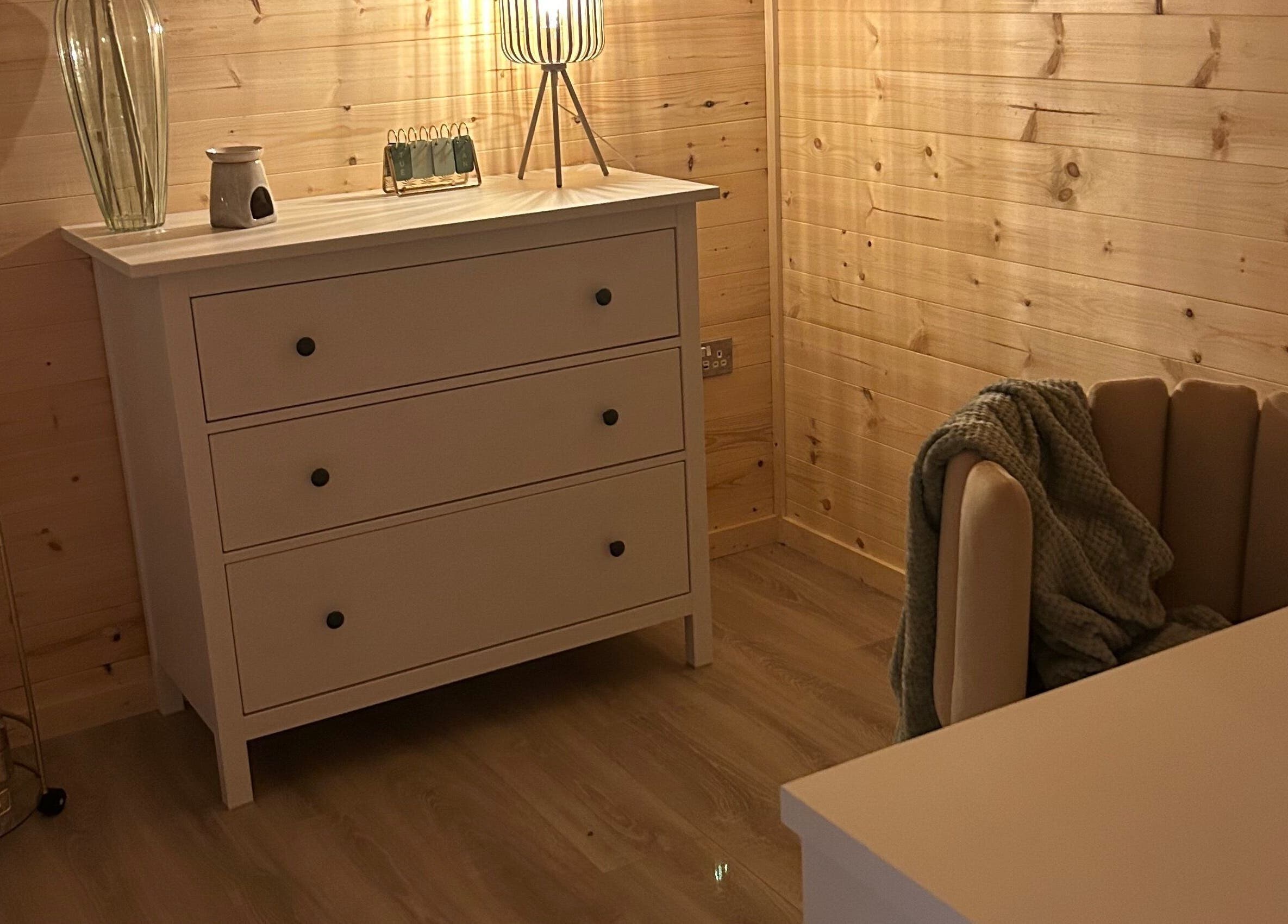 Elegant wooden dresser in a serene space at By Madison Olivia, Kirk Sandall, England, GB.