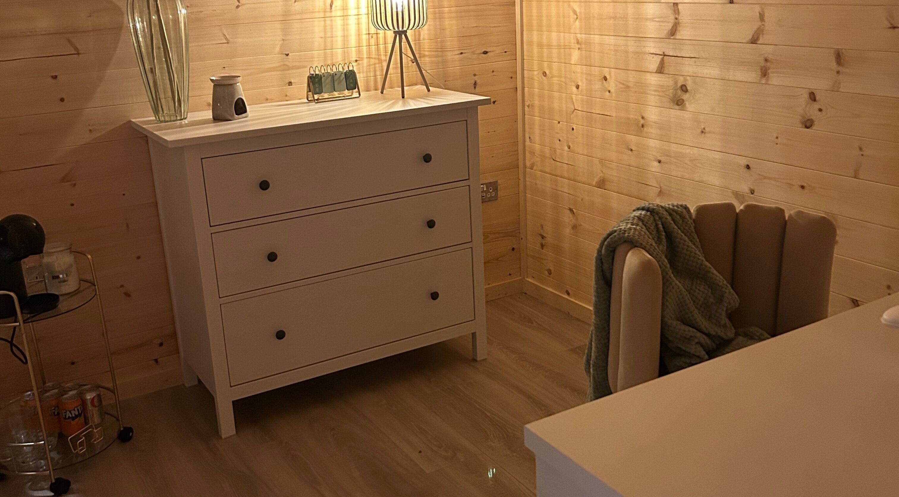 Elegant wooden dresser in a serene space at By Madison Olivia, Kirk Sandall, England, GB.