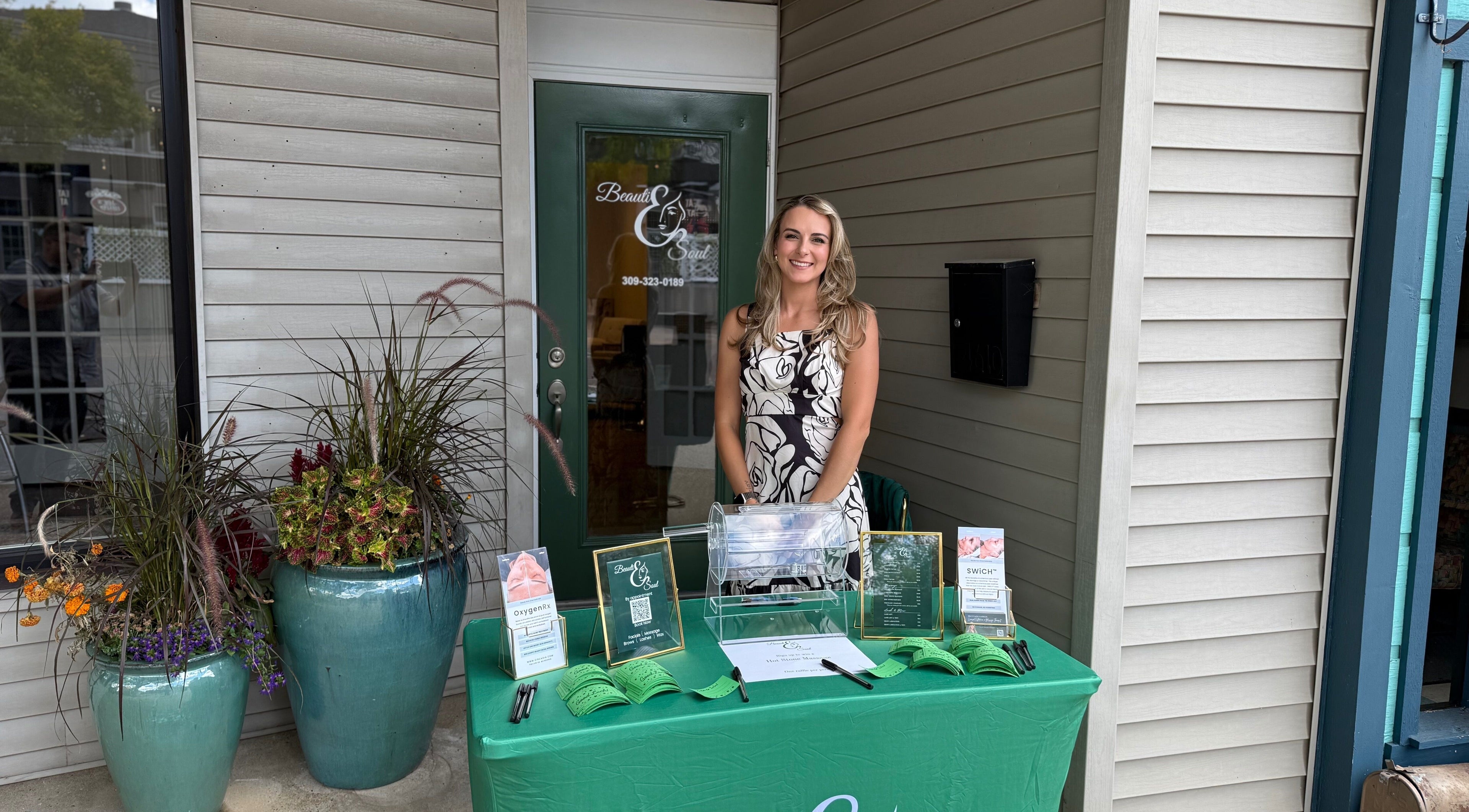 A welcoming display at Beauti & Soul in Peoria Heights, Illinois, US, showcasing vibrant plants and information.