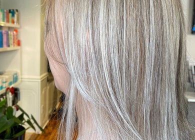 Close-up of sleek blonde hair at Samantha Quick Hair, Niagara Falls, Ontario, CA, showcasing salon expertise.