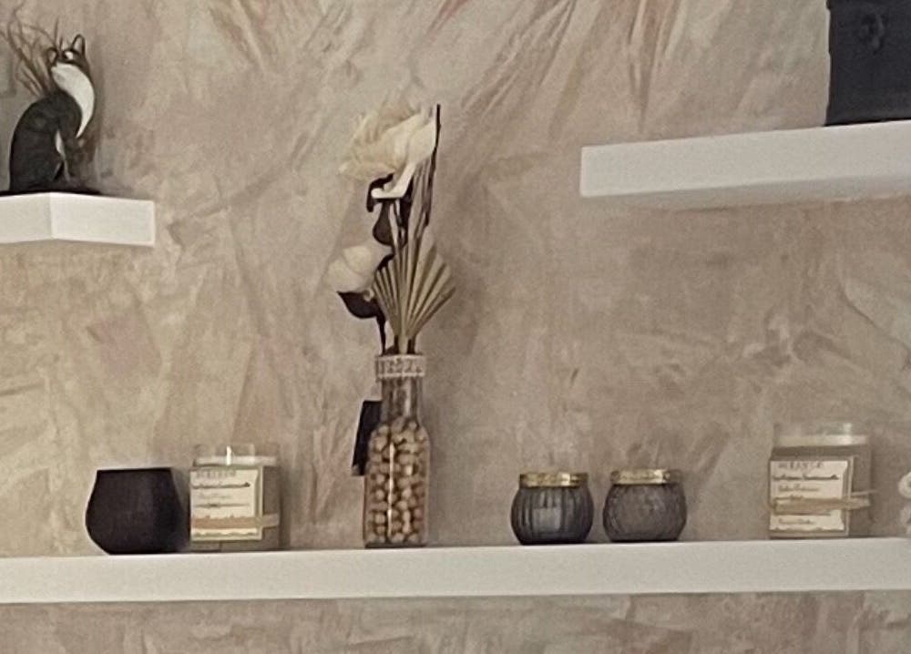 Decorated shelves with candles and decor at BeautyOasis, London, England, GB.