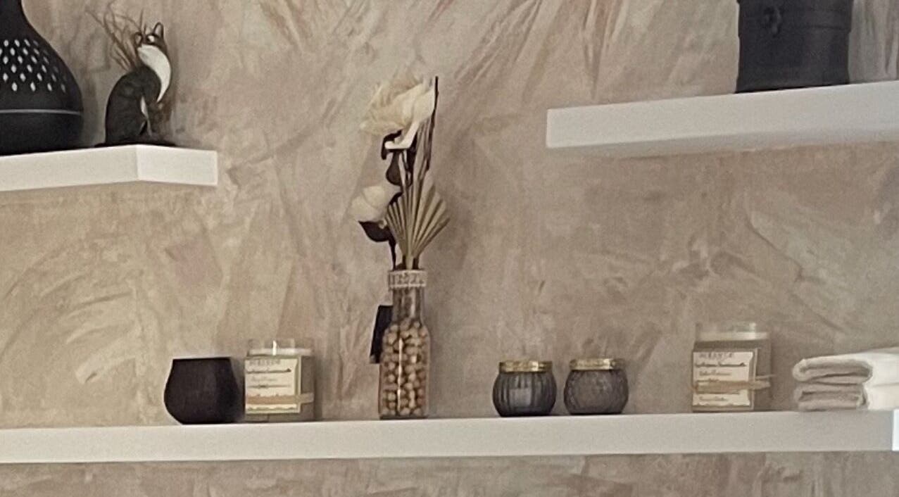 Decorated shelves with candles and decor at BeautyOasis, London, England, GB.