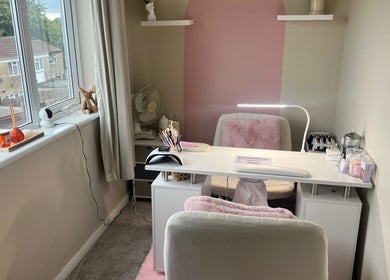 Chic beauty station at AJ Beauty, Bath, England, GB. Modern setup with pink accents and essential tools for wellness.