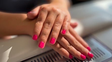 Bright pink manicure at AJ Beauty in Bath, England, GB showcasing elegant nail design.