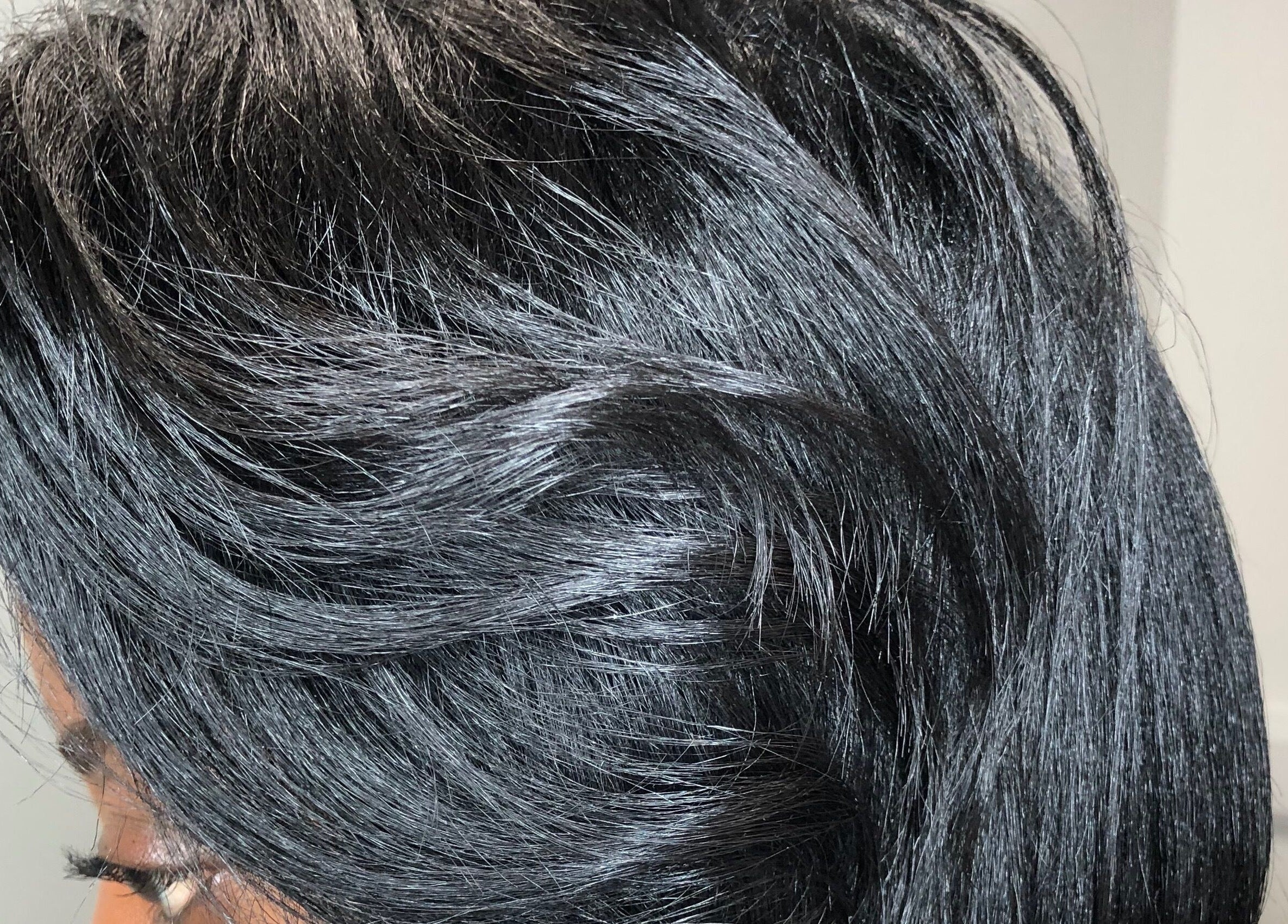 Elegant hairstyle showcasing smooth, shiny black hair at PhedeliaRose, London, England, GB.