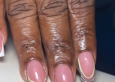 Elegant French nail manicure at Pinkie Polish Nail Room, Saint Michael, BB. Glossy pink finish with white tips.