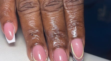 Elegant French nail manicure at Pinkie Polish Nail Room, Saint Michael, BB. Glossy pink finish with white tips.
