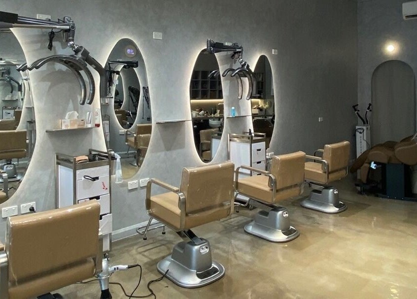 Luxurious salon interior at Ora No1, Lidcombe, New South Wales, AU featuring modern styling chairs.