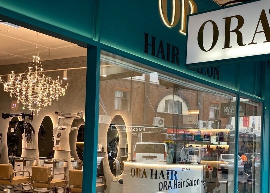 Radiant exterior of Ora No1 in Lidcombe, New South Wales, AU with elegant chandelier lighting.