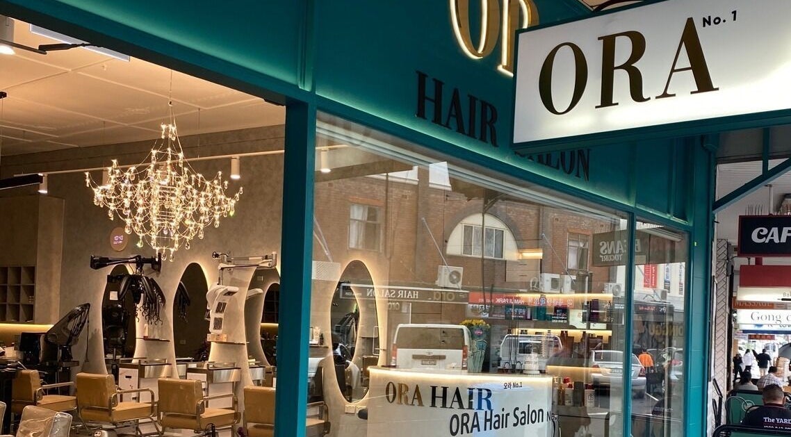 Radiant exterior of Ora No1 in Lidcombe, New South Wales, AU with elegant chandelier lighting.