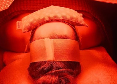 Therapy at KJ Beauty Studio in Mount Helen, Victoria, AU, shows a soothing facial with red light therapy.