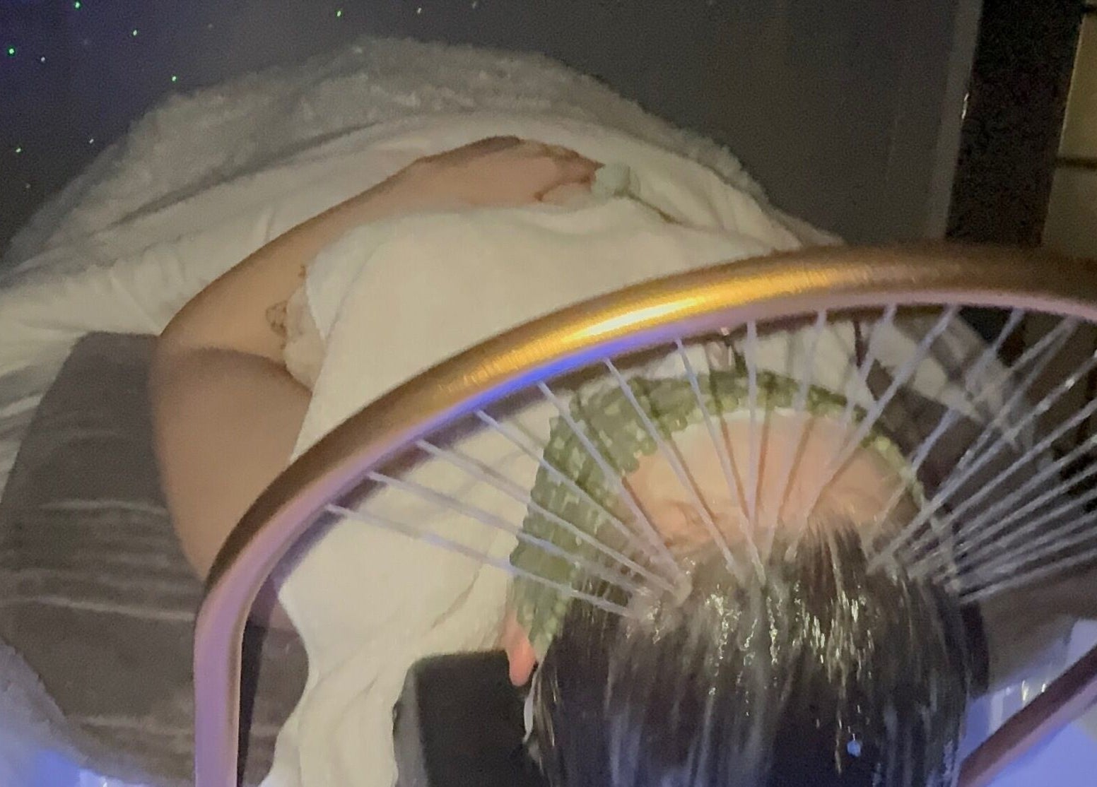 Client enjoying a serene spa treatment at Tre Lux Wellness Lounge, Lisle, Illinois, US.