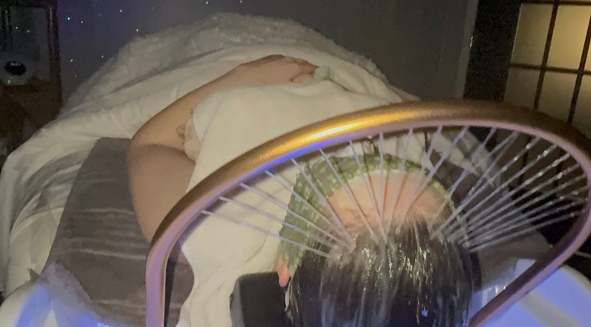 Client enjoying a serene spa treatment at Tre Lux Wellness Lounge, Lisle, Illinois, US.