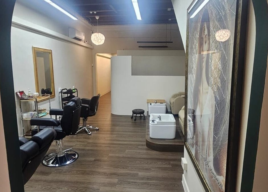 Modern interior of Beauty by Devi salon, featuring chic chairs and treatment areas in Singapore, Singapore, SG.