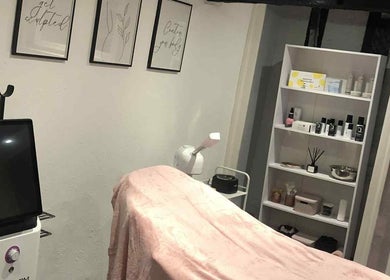 Relaxing therapy room at KM Sculpt & Glow, Congleton, England, GB, showcasing equipment and calming decor.