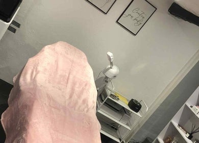 Tranquil treatment room at KM Sculpt & Glow in Congleton, England with soft lighting and cozy decor.