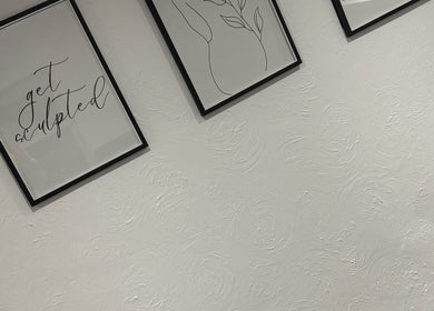 Modern wall art at KM Sculpt & Glow, Congleton, England, GB, featuring inspiring quote and line drawings.