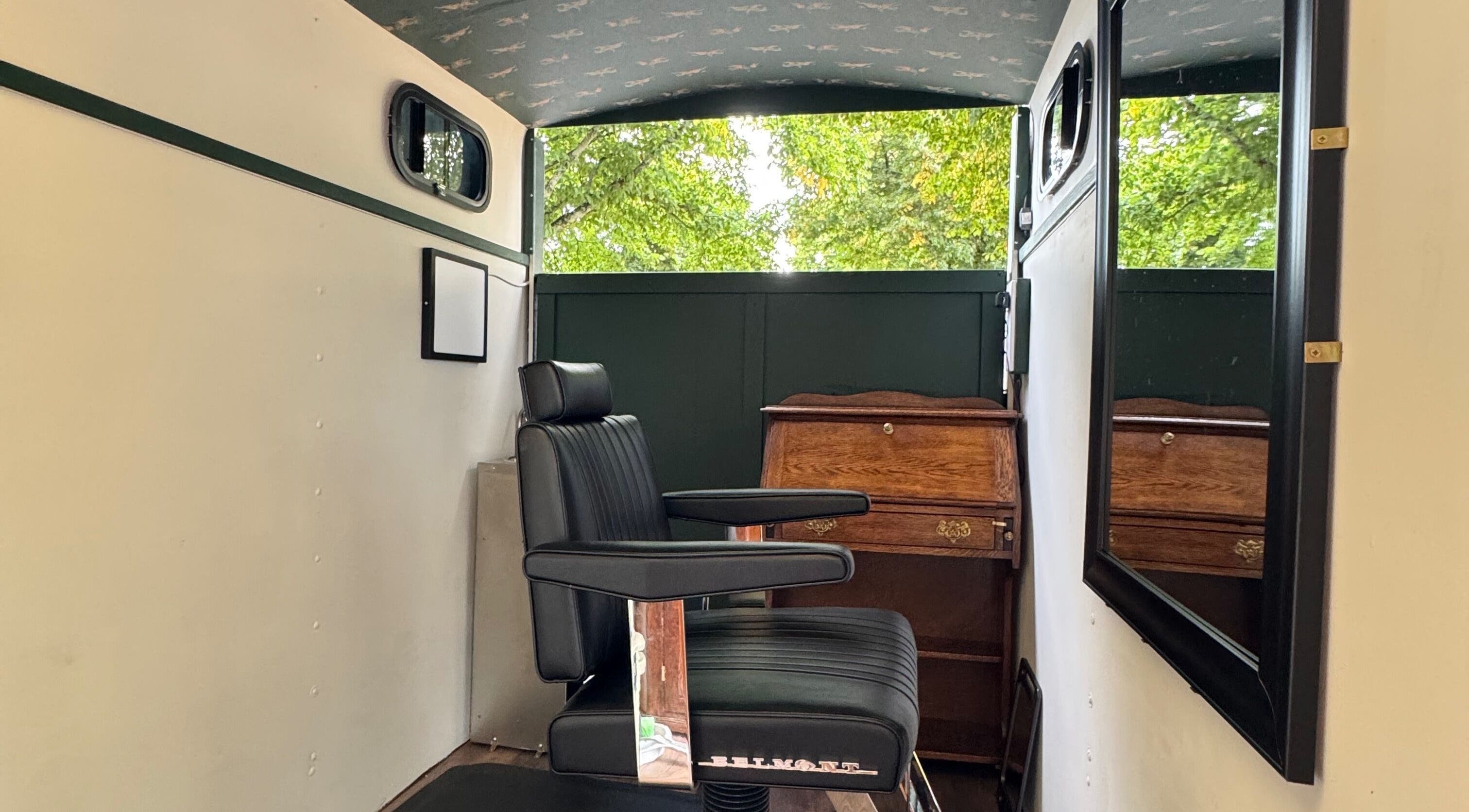 Elegant barber chair at Shelly The Barber, Rogerstone, Wales, GB, showcasing vintage style and comfort.