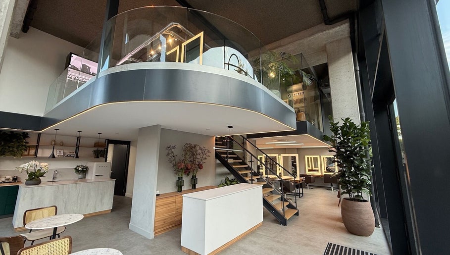 Modern salon interior at GP Hair Experience, Amsterdam, Noord-Holland, NL, featuring sleek design and natural light.