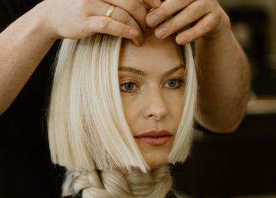 Stylist enhancing blonde bob at GP Hair Experience, Amsterdam, Noord-Holland, NL.