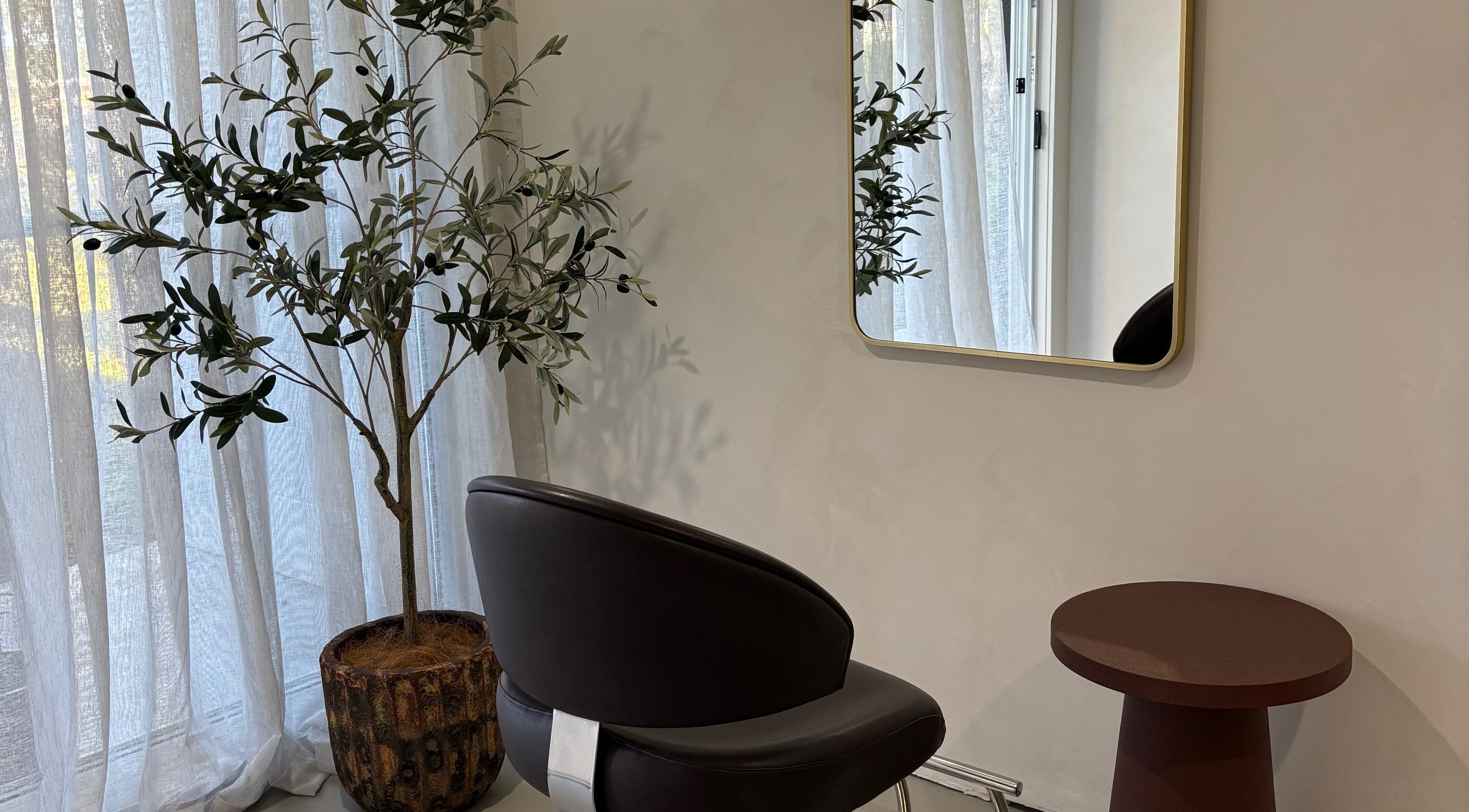 Elegant salon corner with chair and mirror at Hair by Holly Stewart, Nambour, Queensland, AU.