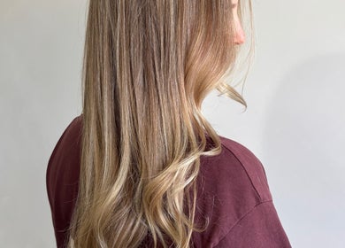 Sleek long hair styled at Hair by Holly Stewart, Nambour, Queensland, AU, showcasing subtle highlights.