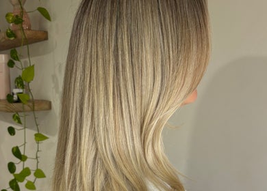 Elegant blonde highlights in soft waves at hair by Holly Stewart, Nambour, Queensland, AU.
