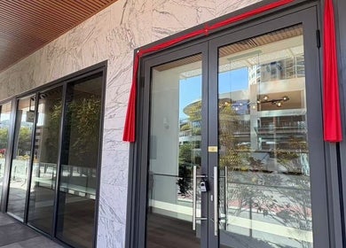 Entrance of Soluna Dermal and Aesthetic Clinic in South Perth, Western Australia with modern glass and marble.