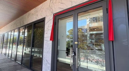 Entrance of Soluna Dermal and Aesthetic Clinic in South Perth, Western Australia with modern glass and marble.