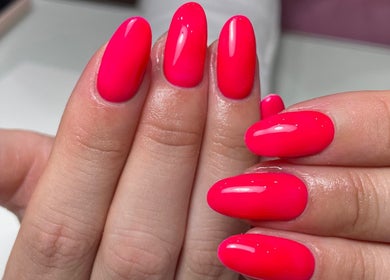 Bright pink manicured nails displayed at ByKayla.Sb, Blackpool, England, GB.