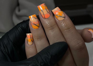 Bright orange nails with artistic black lines at ByKayla.Sb, Blackpool, England, GB.