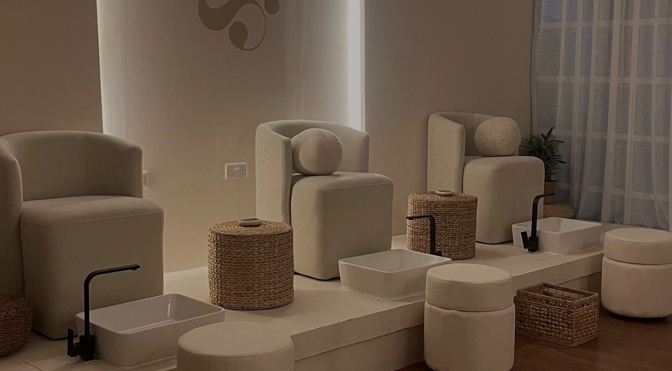 Elegant pedicure chairs at Gleam Beauty Lounge, Muscat. Luxurious setting in Muscat Governorate, OM.