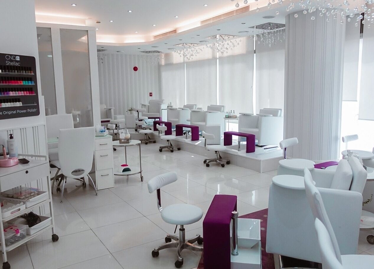 Luxurious interior of Nails Couture Ladies Salon in Abu Dhabi, Abu Dhabi, AE, featuring modern white decor.