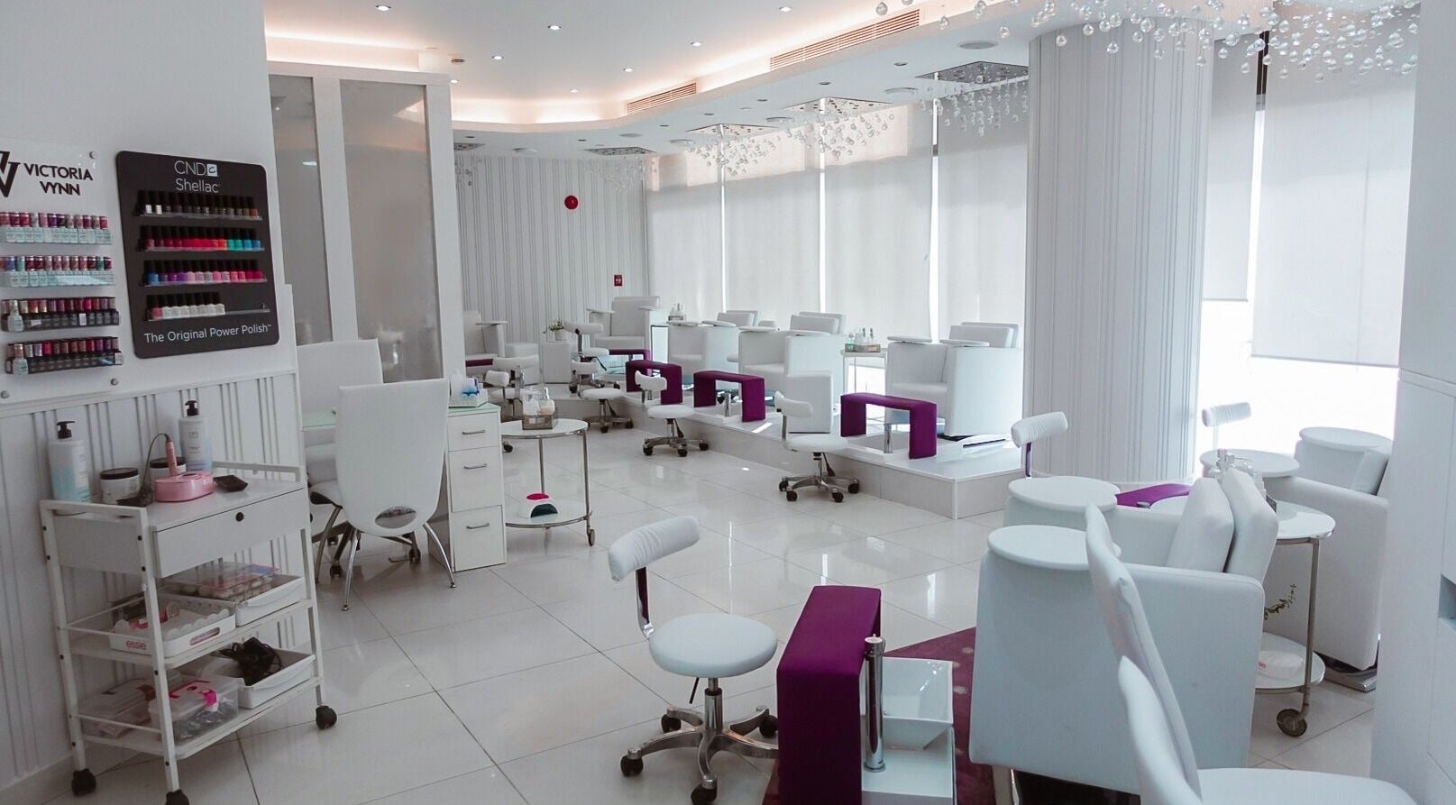 Luxurious interior of Nails Couture Ladies Salon in Abu Dhabi, Abu Dhabi, AE, featuring modern white decor.
