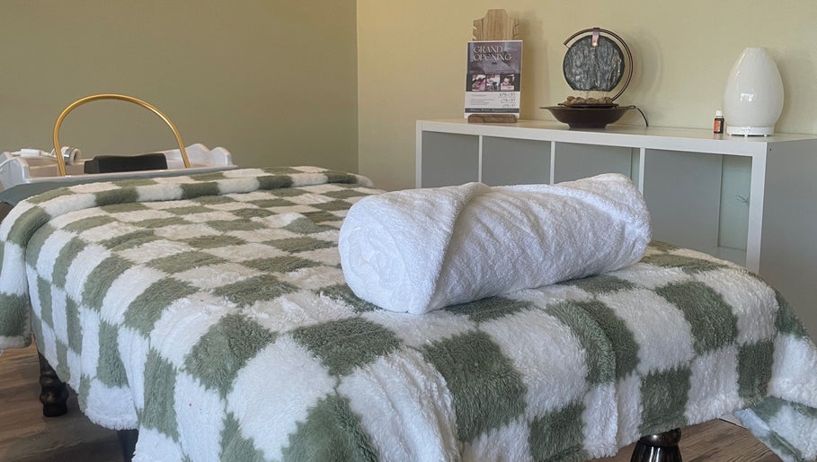 Calming spa room with massage table at Spa Eves | Scalp Spa + Massage in Austin, Texas, US.