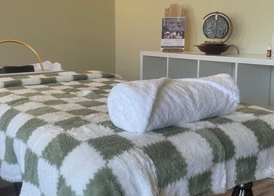 Calming spa room with massage table at Spa Eves | Scalp Spa + Massage in Austin, Texas, US.