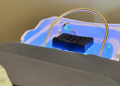 Relaxing scalp spa tub at Spa Eves | Scalp Spa + Massage in Austin, Texas, US, glowing with blue soothing light.
