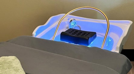 Relaxing scalp spa tub at Spa Eves | Scalp Spa + Massage in Austin, Texas, US, glowing with blue soothing light.