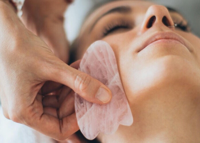 Luxurious rose quartz facial massage at Spa Eves | Scalp Spa + Massage in Austin, Texas, US.