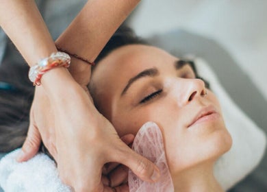 Relaxing face massage at Spa Eves | Scalp Spa + Massage in Austin, Texas, US. Gentle hands applying soothing treatment.
