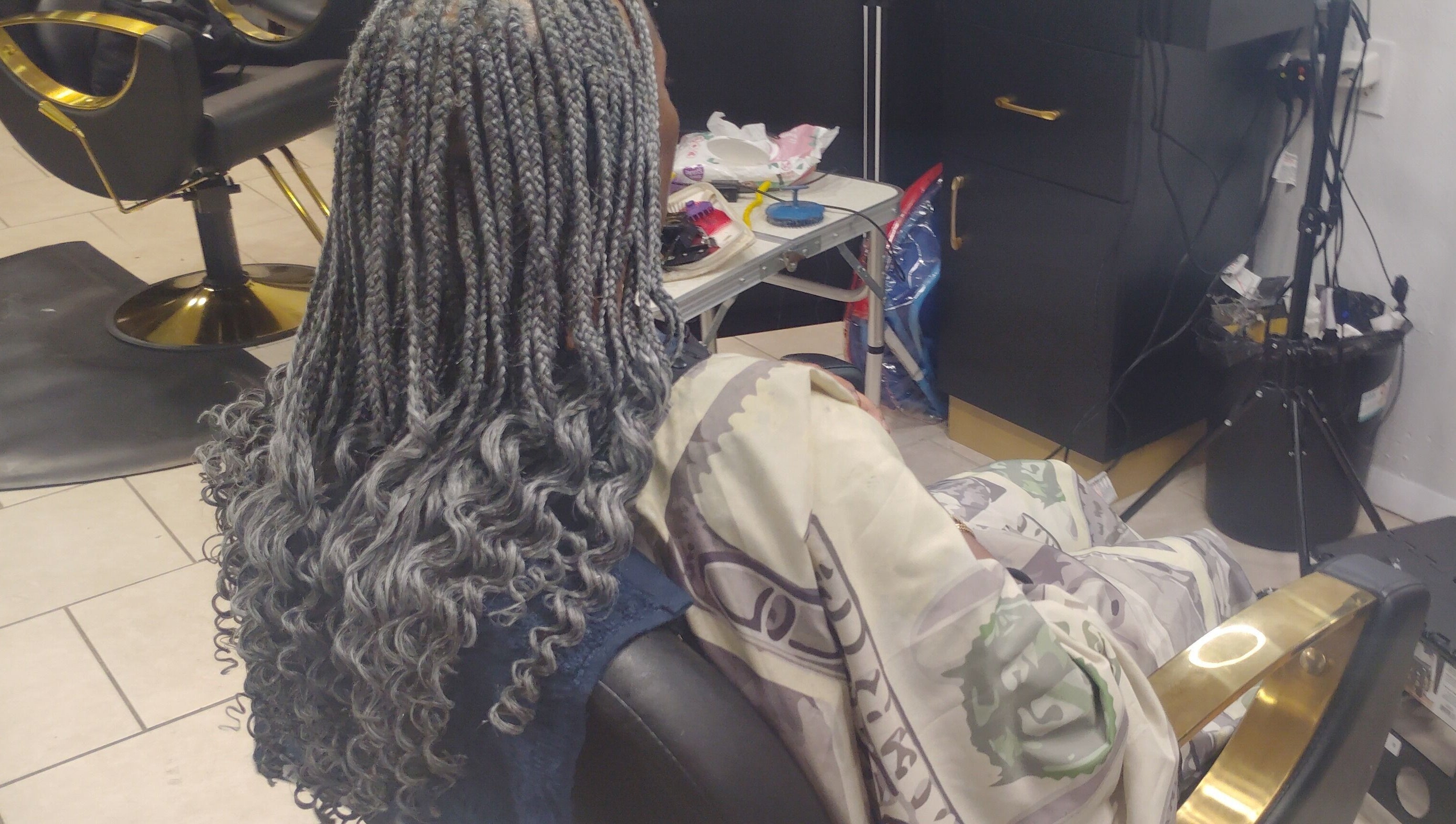 Intricate braided hair styling at Lux Creative Styles LLC, New Port Richey, Florida, US showcasing unique craftsmanship.