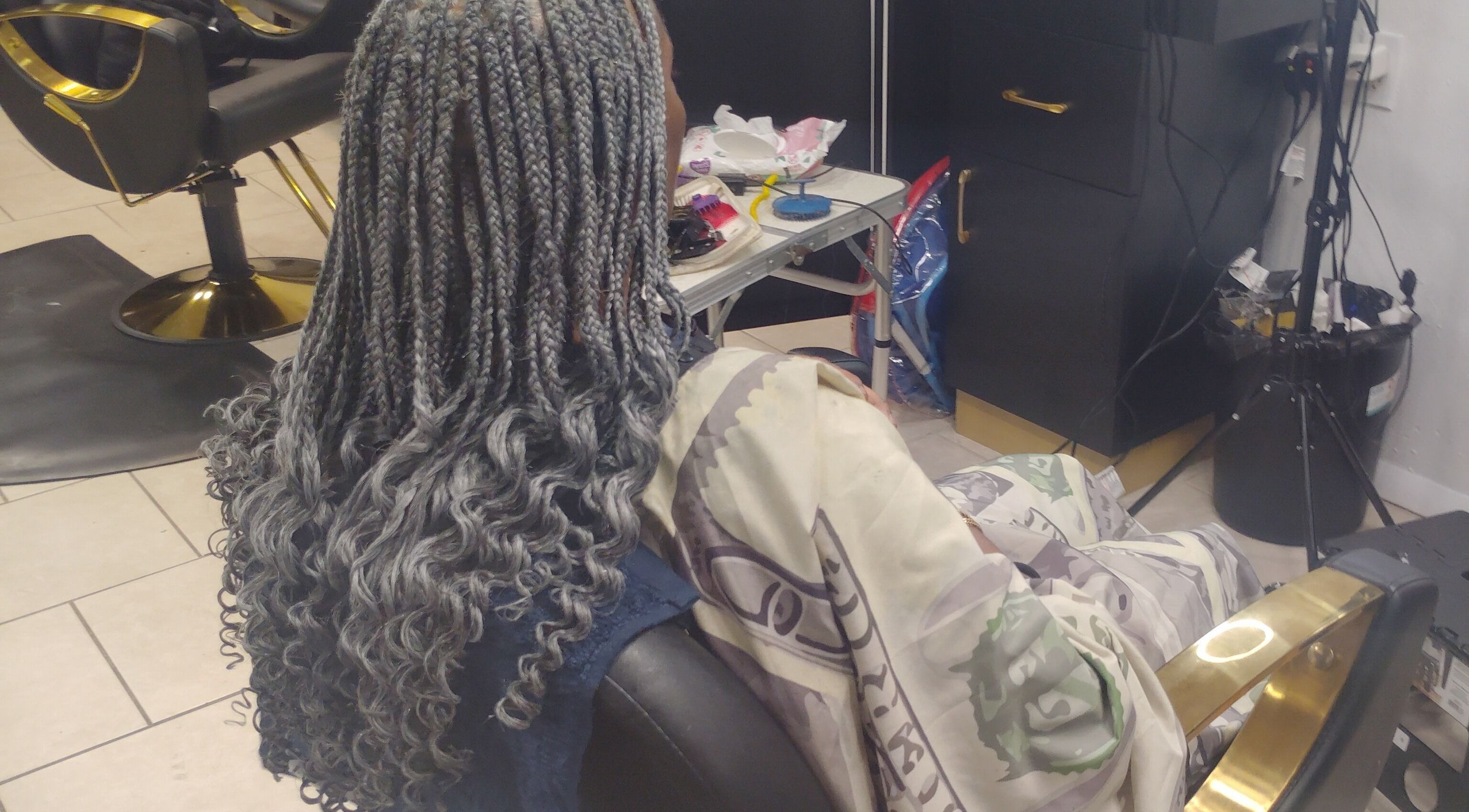 Intricate braided hair styling at Lux Creative Styles LLC, New Port Richey, Florida, US showcasing unique craftsmanship.