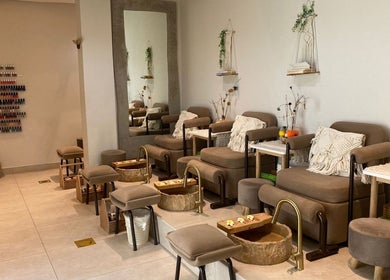 Luxurious pedicure seats at Bali Nails & Lashes, Al Ain, Abu Dhabi, AE with elegant decor and modern amenities.