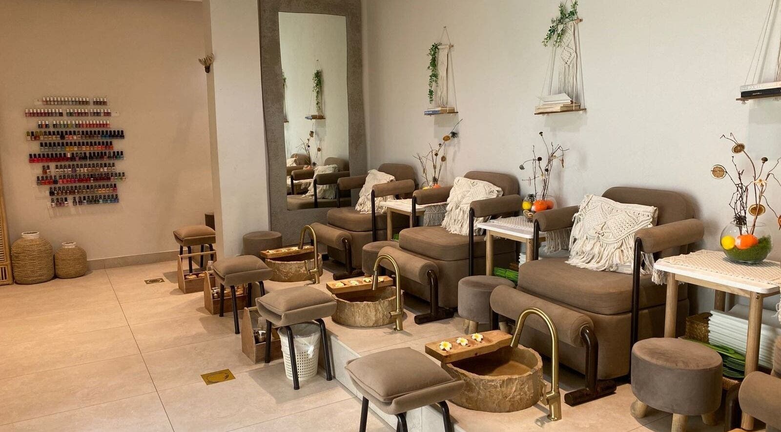 Luxurious pedicure seats at Bali Nails & Lashes, Al Ain, Abu Dhabi, AE with elegant decor and modern amenities.
