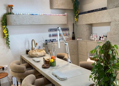 Elegant nail bar at Bali Nails & Lashes, Al Ain, Abu Dhabi, AE. Featuring modern decor and lush plants.