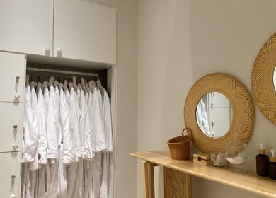 Elegant spa robes and wooden accents at Bali Nails & Lashes, Al Ain, Abu Dhabi, AE, highlighting tranquil elegance.