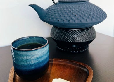 Meditative tea setting at Yoganic Thai Spa and Massage in London, England, GB, showcasing calm elegance.