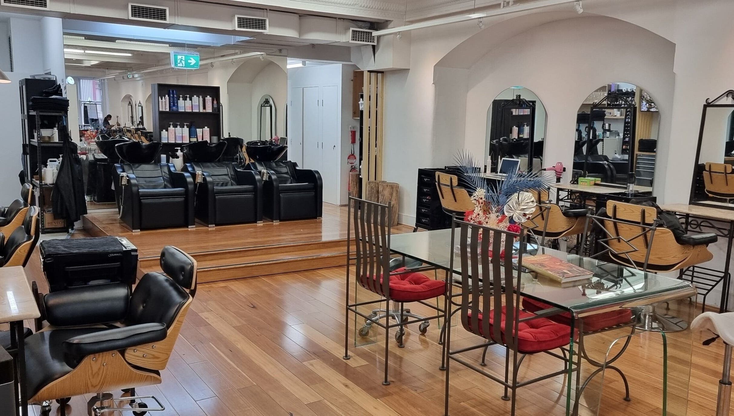 Luxurious salon interior at L'Etoile Elite, Sydney, New South Wales, AU with stylish chairs and modern décor.