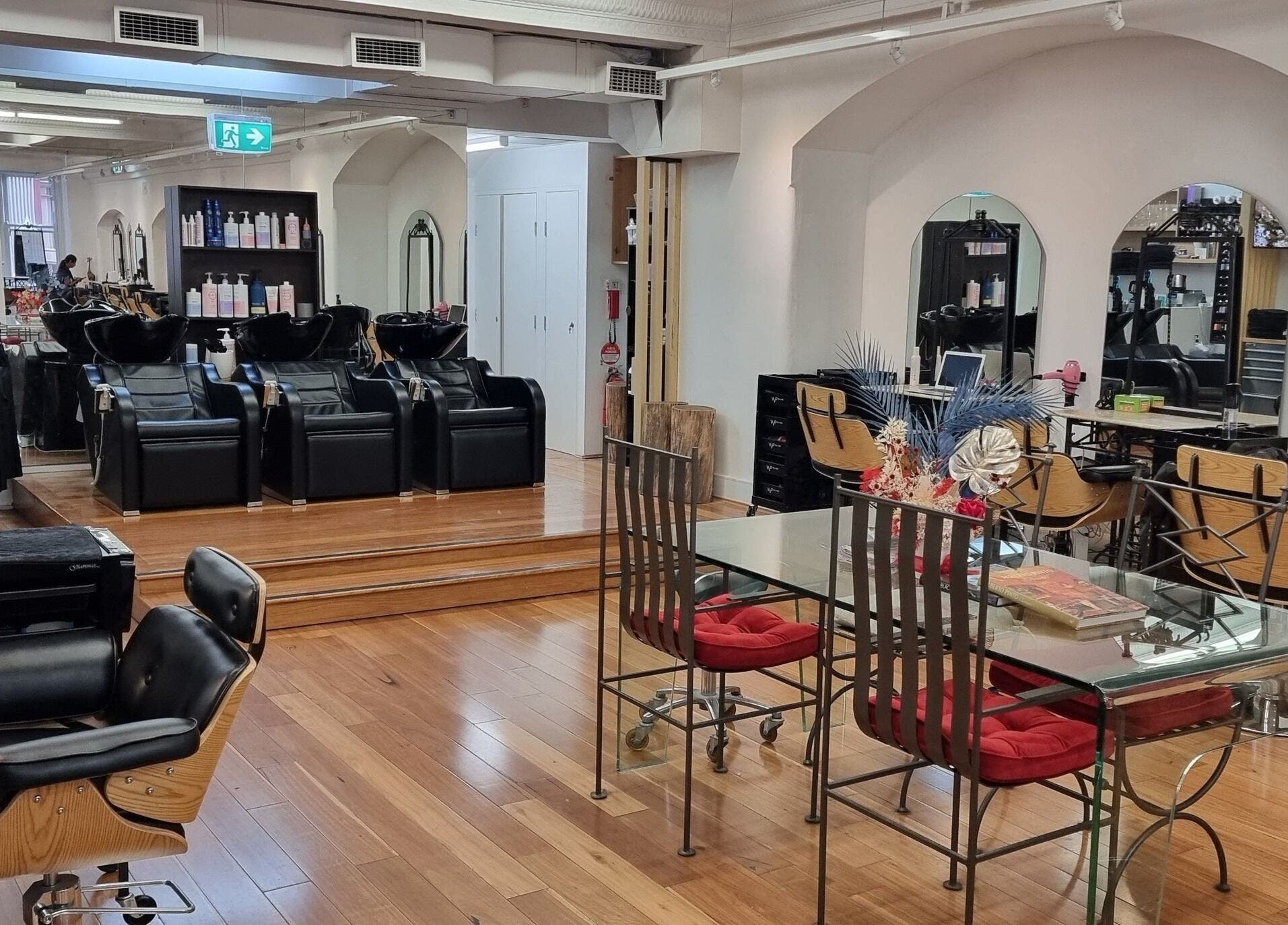 Luxurious salon interior at L'Etoile Elite, Sydney, New South Wales, AU with stylish chairs and modern décor.